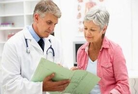 A woman with arthritis at a doctor's appointment for a doctor